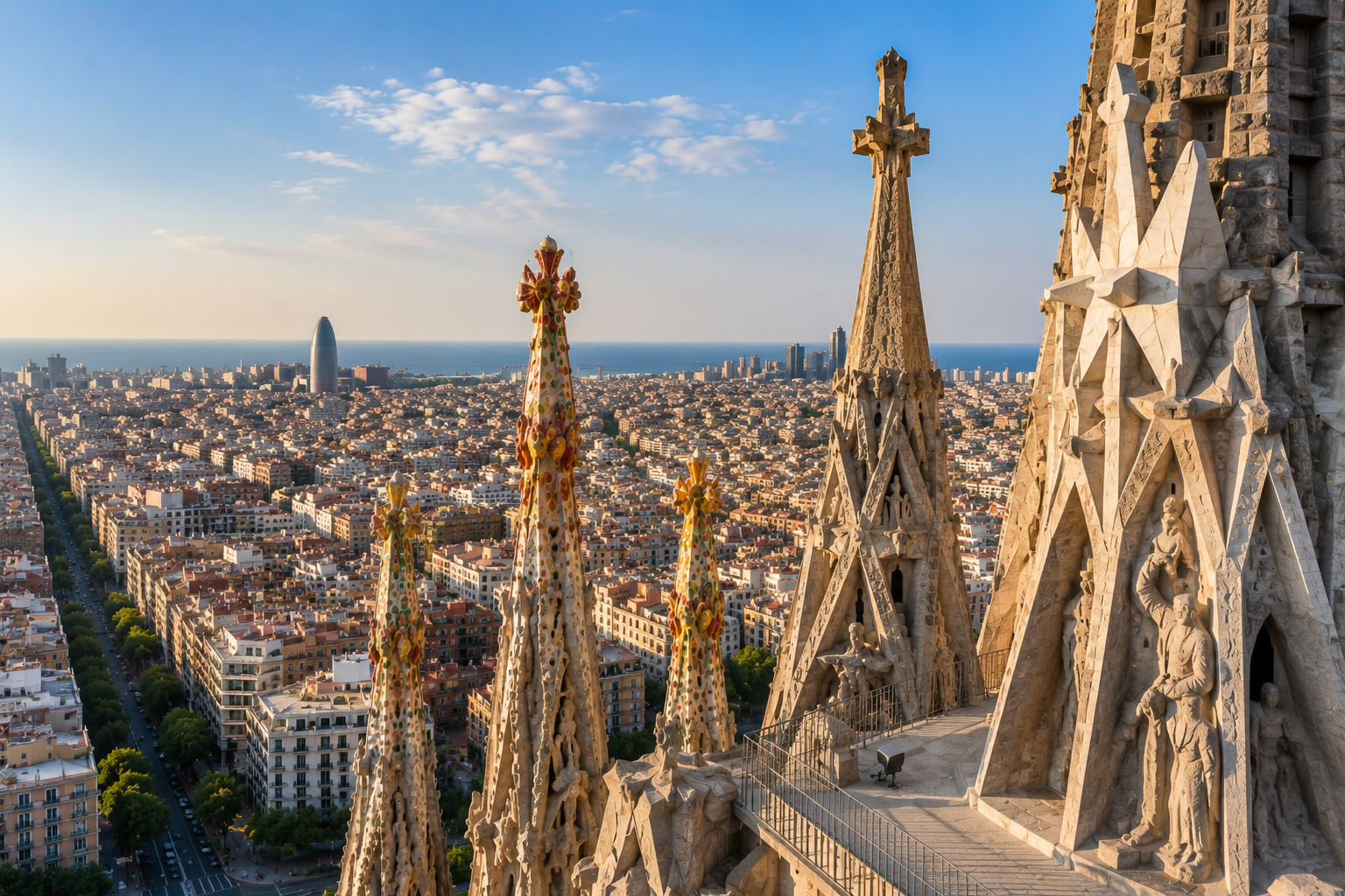 Panoramic view from the Sagrada Família Passion Tower overlooking Barcelona and the Mediterranean Sea.